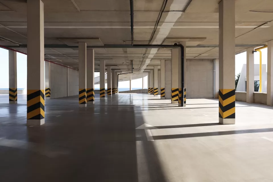 Empty elevated parking garage with sunlight coming in.
